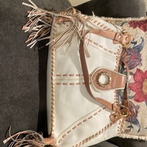 I am selling brand new never used KATE LANDRY purse. Has sales tag.